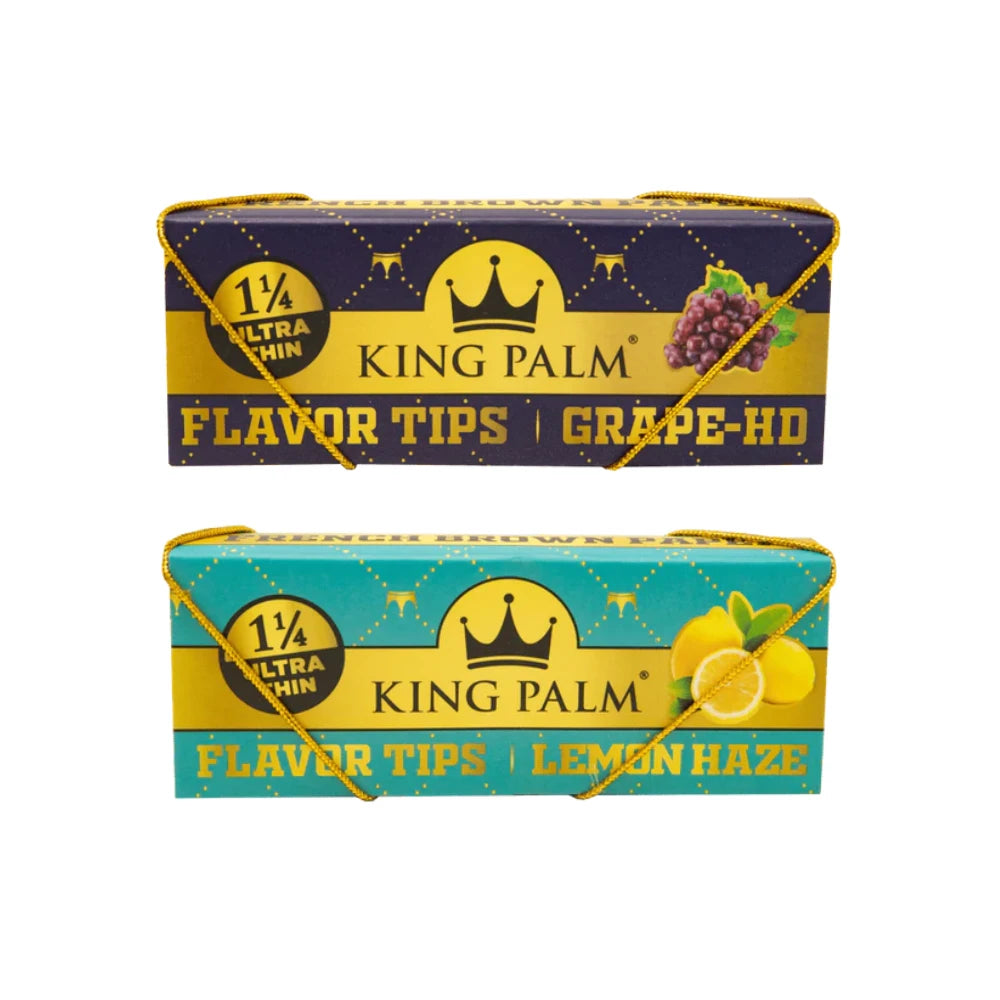 King Palm Papers & Flavor Tips 1¼ Size Ultra Thin – zwei Booklets übereinander: oben Grape-HD in Dunkelblau-Gold mit Traubenillustration, unten Lemon Haze in Türkis-Gold mit Zitronenillustration, beide mit goldenem Zugband